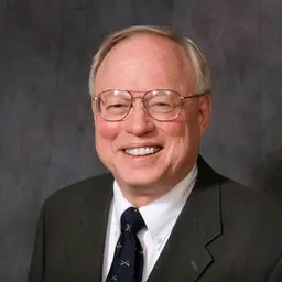 Hans Andersen, the CPA who built Andersen Accounting, in a dark suit and tie.